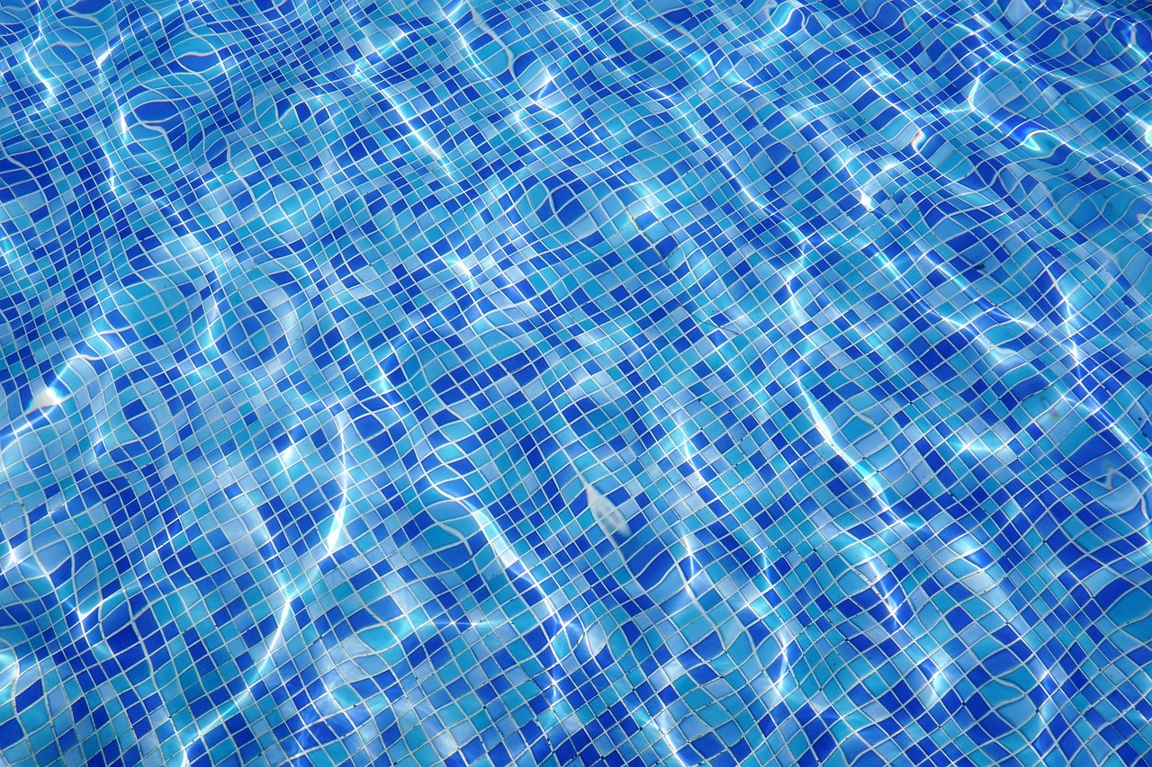 Pool builders working on a backyard pool in Henderson, NV